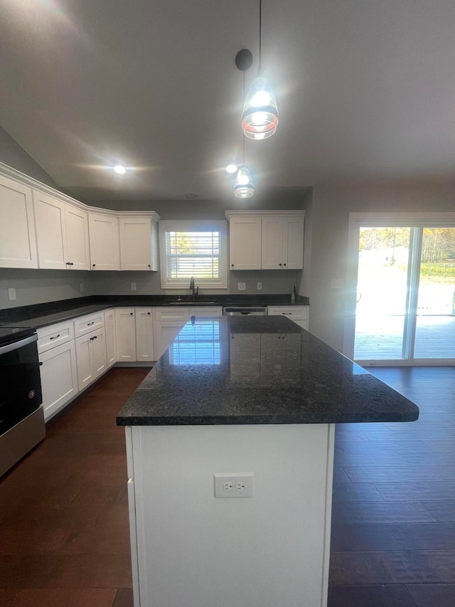 kitchen featuring white cabinets, dark hardwood / wood-style floors, and a wealth of natural light