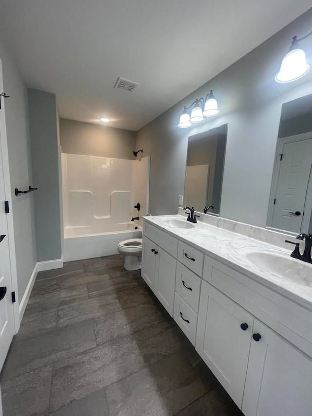 full bathroom featuring  shower combination, vanity, and toilet