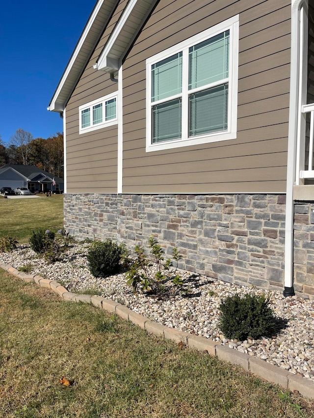 view of home's exterior featuring a lawn