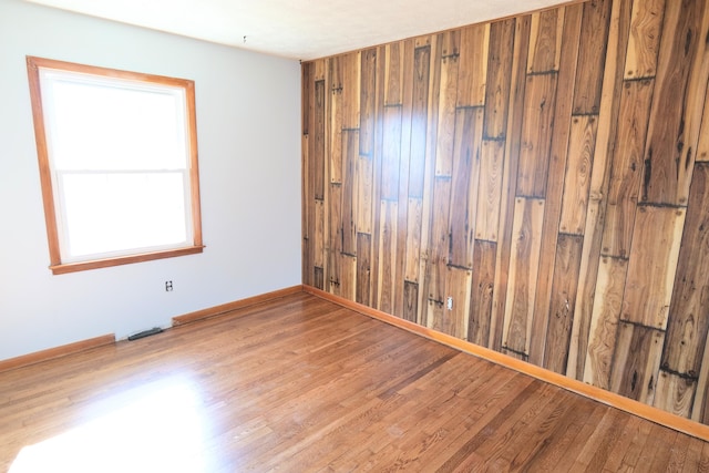 spare room featuring light wood-type flooring