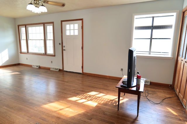 entrance foyer featuring ceiling fan and hardwood / wood-style floors