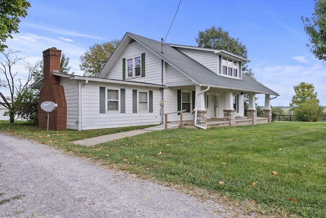 view of front of property with a front lawn and a porch