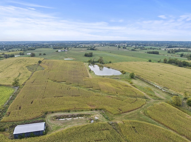 drone / aerial view featuring a water view and a rural view