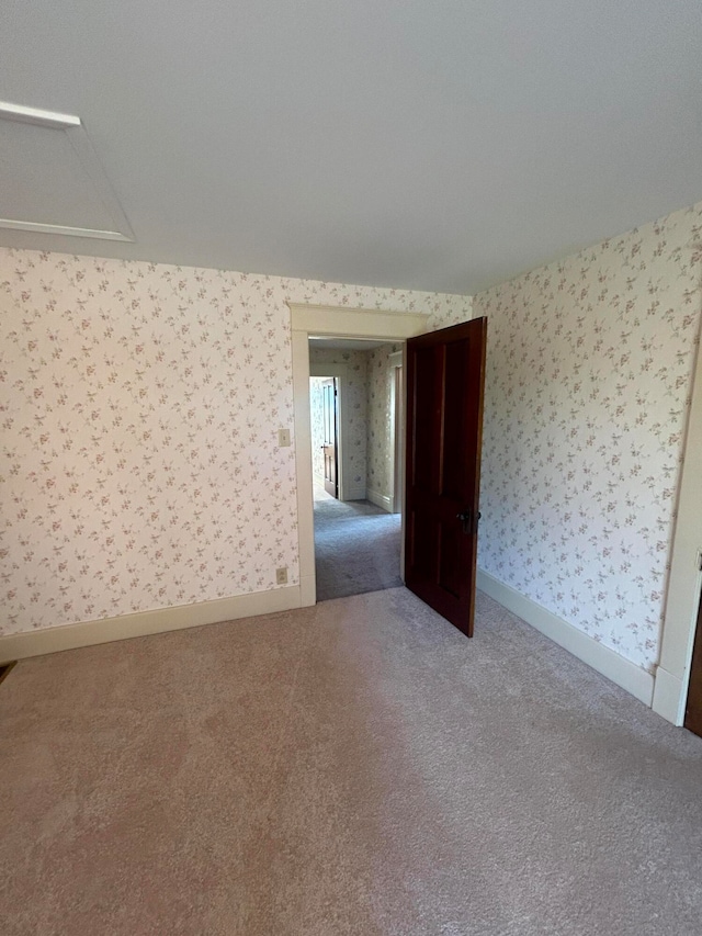 spare room featuring carpet