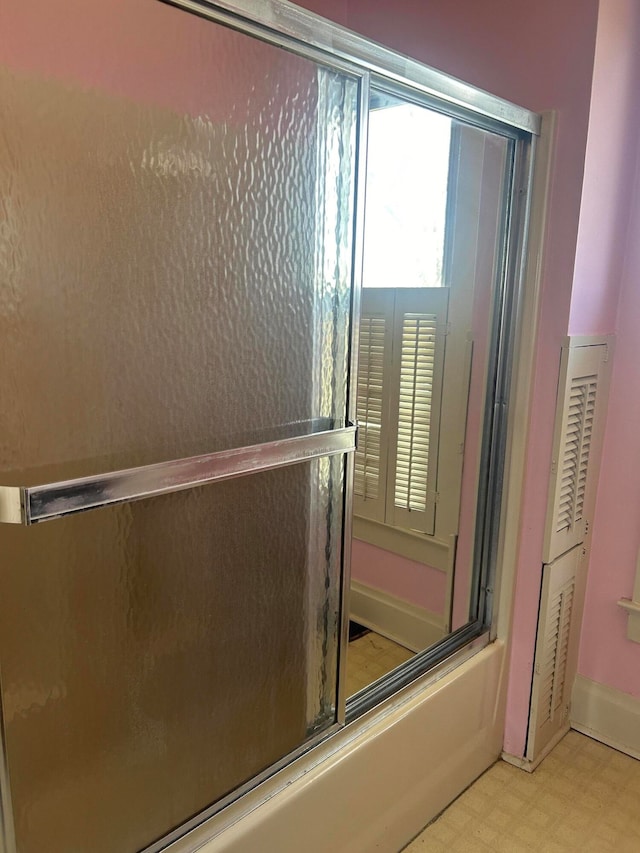 bathroom featuring enclosed tub / shower combo