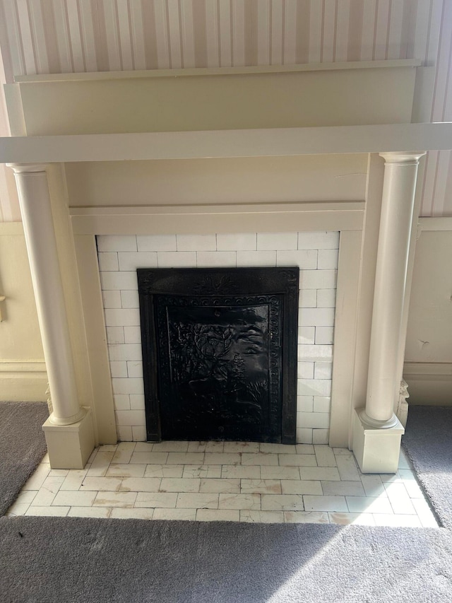 room details with carpet flooring and a fireplace