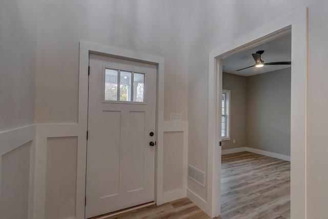 foyer featuring ceiling fan and light wood-type flooring