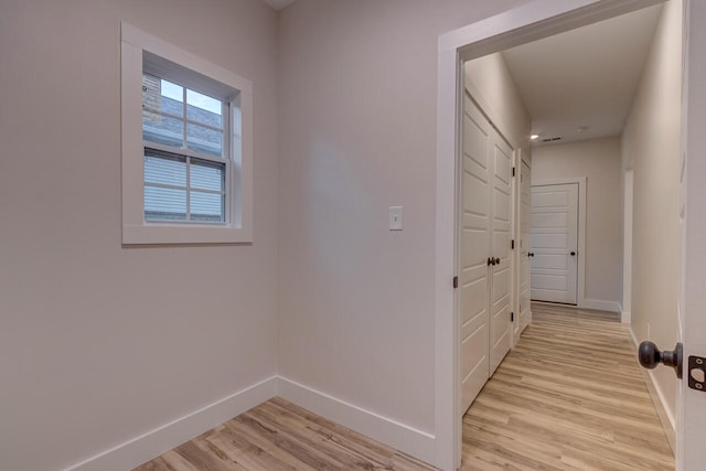 corridor featuring light hardwood / wood-style flooring