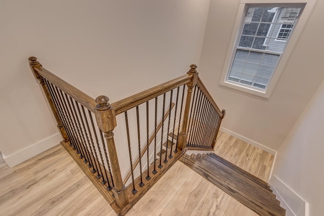 staircase featuring hardwood / wood-style floors