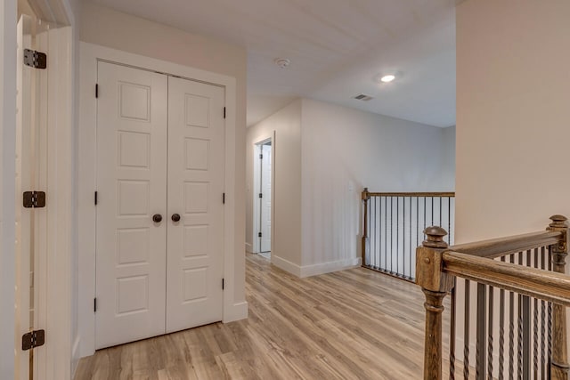 hall with light hardwood / wood-style floors