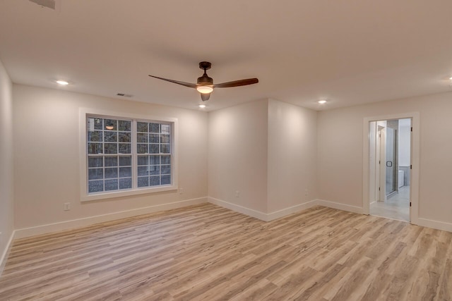 empty room featuring light hardwood / wood-style floors and ceiling fan