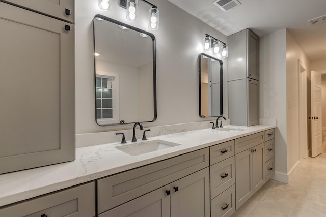 bathroom with vanity and tile patterned floors