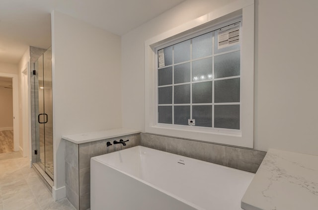 bathroom featuring tile patterned floors and plus walk in shower