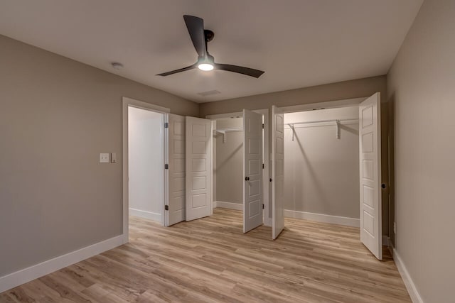 unfurnished bedroom featuring light hardwood / wood-style floors and ceiling fan