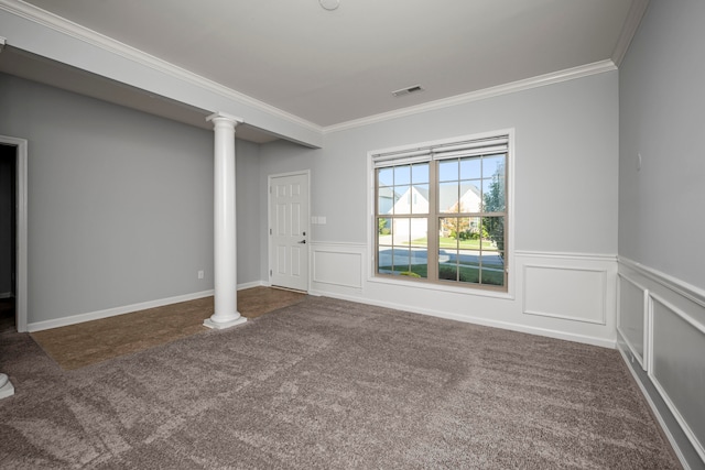 interior space with dark carpet, ornamental molding, and ornate columns