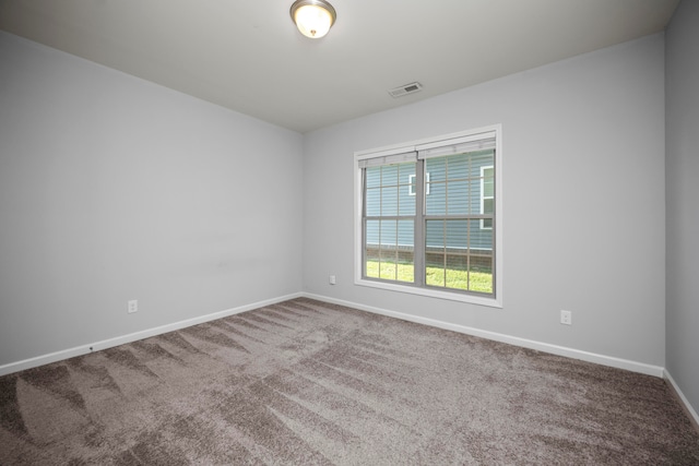 spare room featuring carpet