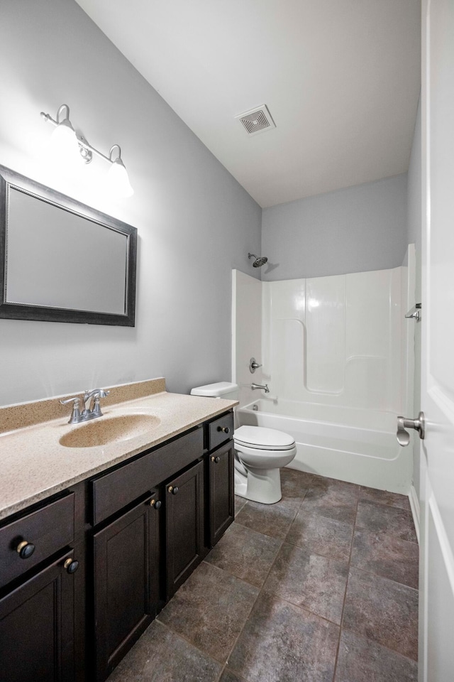 full bathroom featuring vanity, toilet, and  shower combination