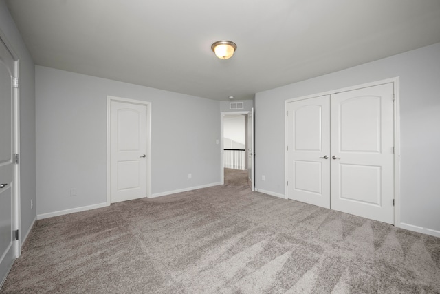 unfurnished bedroom with carpet floors