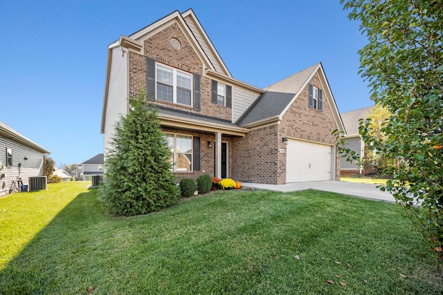 craftsman-style house featuring a front yard, a garage, and central air condition unit