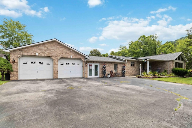 ranch-style house featuring a garage