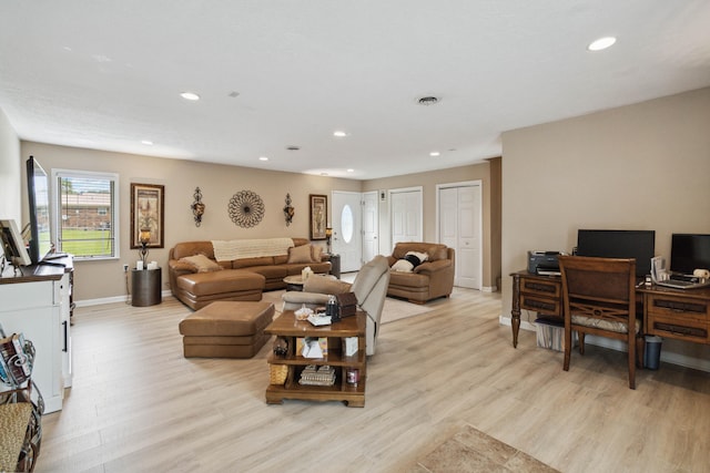 living room with light hardwood / wood-style flooring