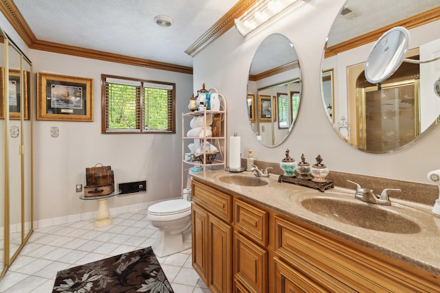 bathroom featuring tile patterned floors, toilet, ornamental molding, vanity, and a textured ceiling