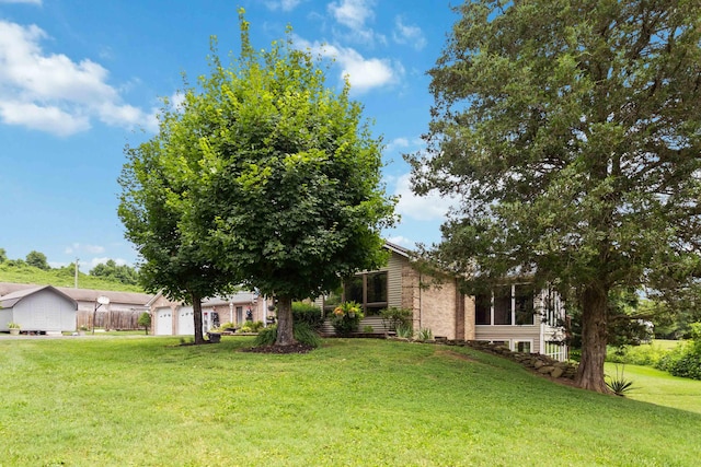 view of front of house with a front lawn and a garage