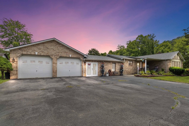 single story home featuring a garage