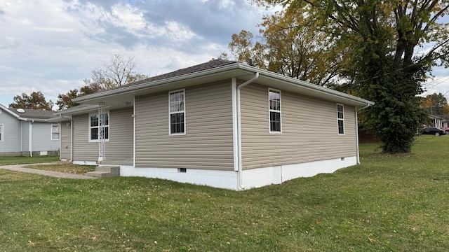 view of home's exterior with a lawn