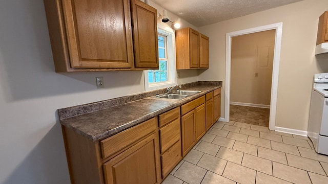 kitchen featuring light tile patterned floors, extractor fan, a textured ceiling, white electric stove, and sink