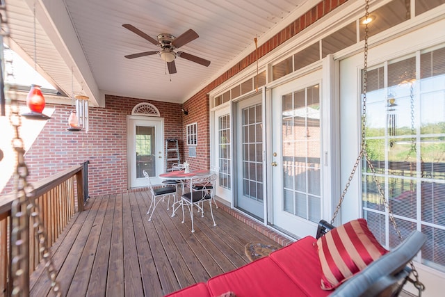 wooden deck featuring ceiling fan