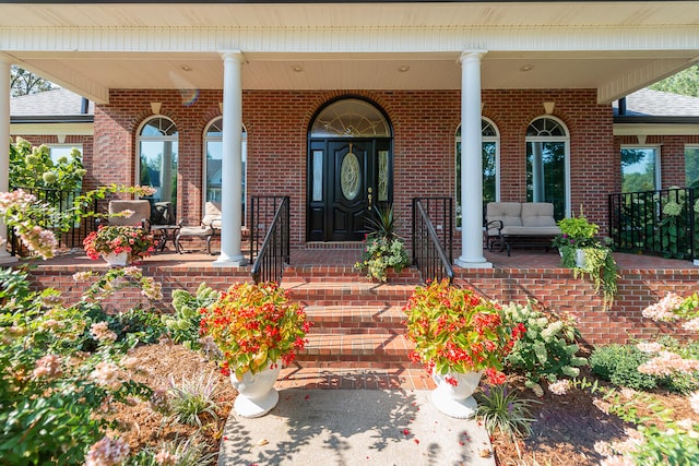 doorway to property with a porch