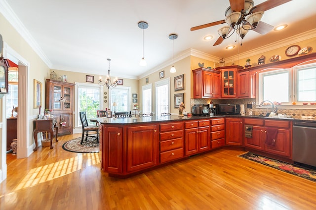 kitchen with dishwasher, light hardwood / wood-style flooring, hanging light fixtures, ornamental molding, and ceiling fan with notable chandelier