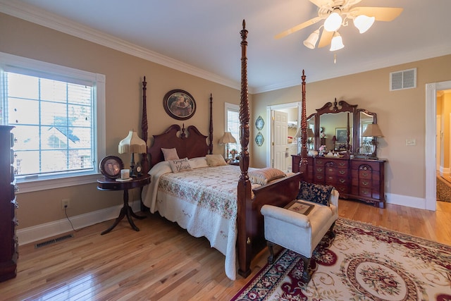 bedroom featuring light hardwood / wood-style floors, ornamental molding, and ceiling fan