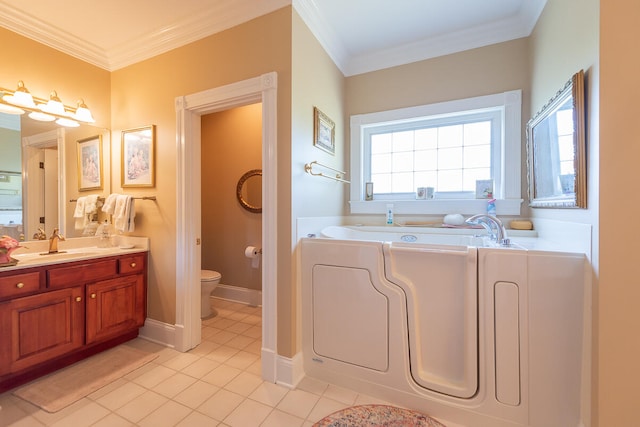 bathroom featuring toilet, tile patterned flooring, a bathtub, ornamental molding, and vanity