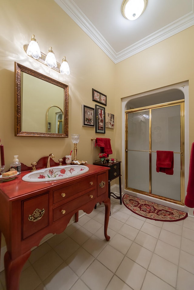 bathroom featuring vanity, crown molding, a shower with shower door, and tile patterned flooring