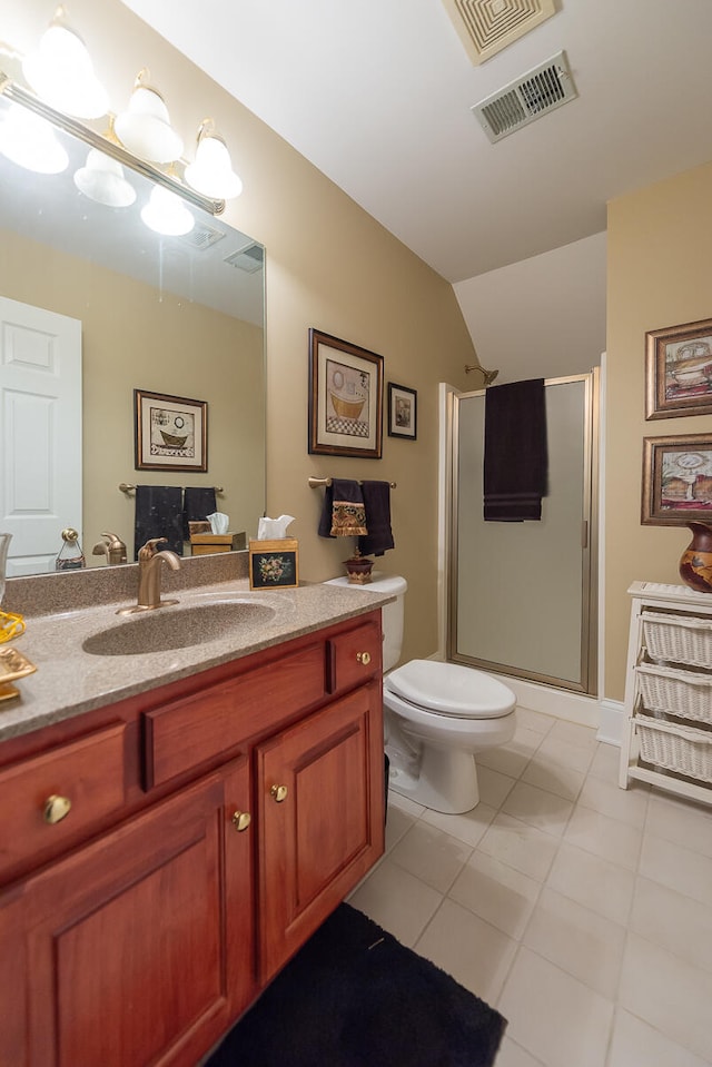 bathroom featuring lofted ceiling, toilet, tile patterned flooring, a shower with shower door, and vanity