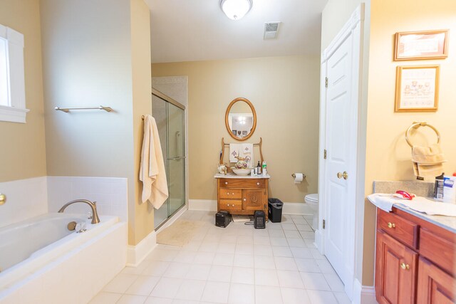 full bathroom featuring vanity, toilet, and separate shower and tub