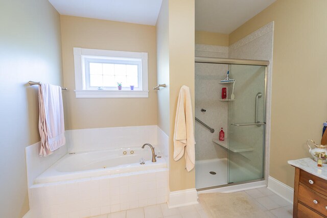 bathroom featuring vanity, separate shower and tub, and tile patterned flooring