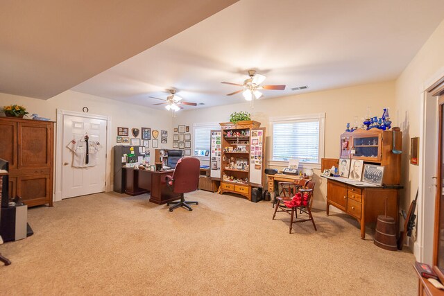 home office with light colored carpet and ceiling fan