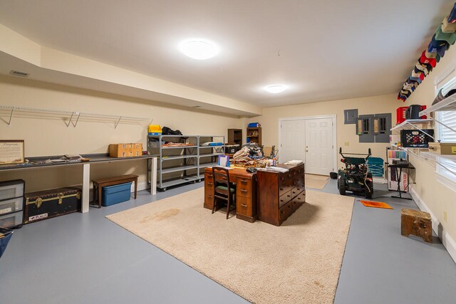 office area with concrete flooring