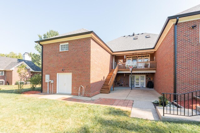 rear view of property with a patio area and a lawn