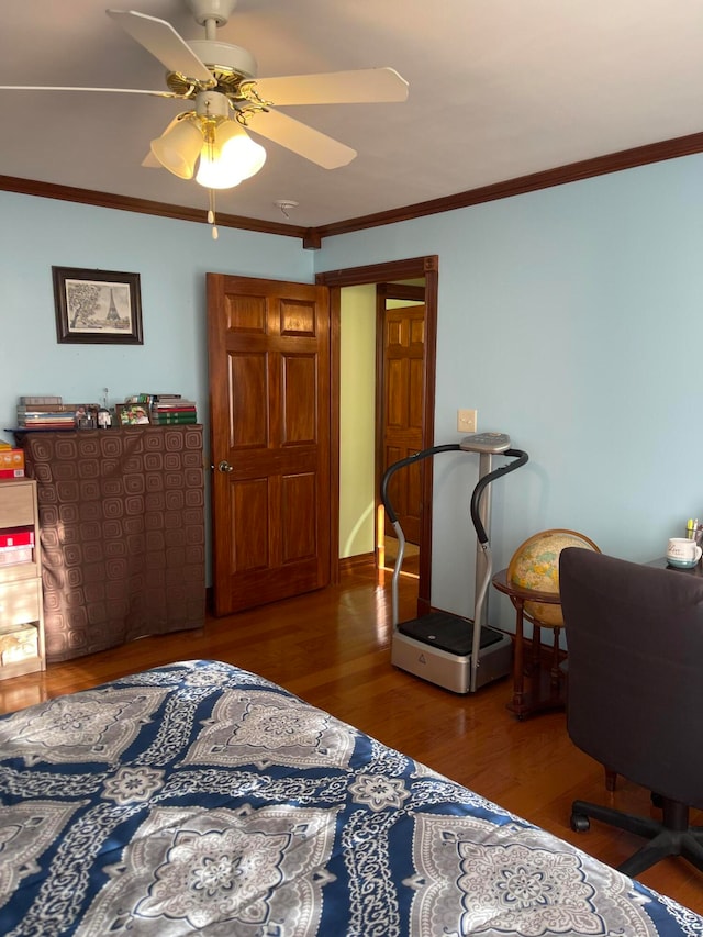 bedroom featuring crown molding, hardwood / wood-style flooring, and ceiling fan