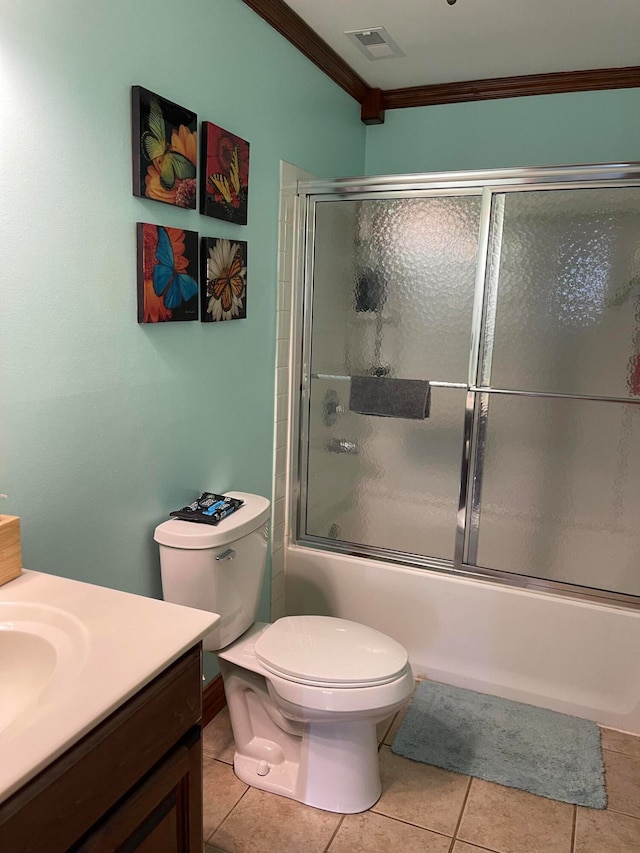 full bathroom with combined bath / shower with glass door, toilet, vanity, crown molding, and tile patterned flooring