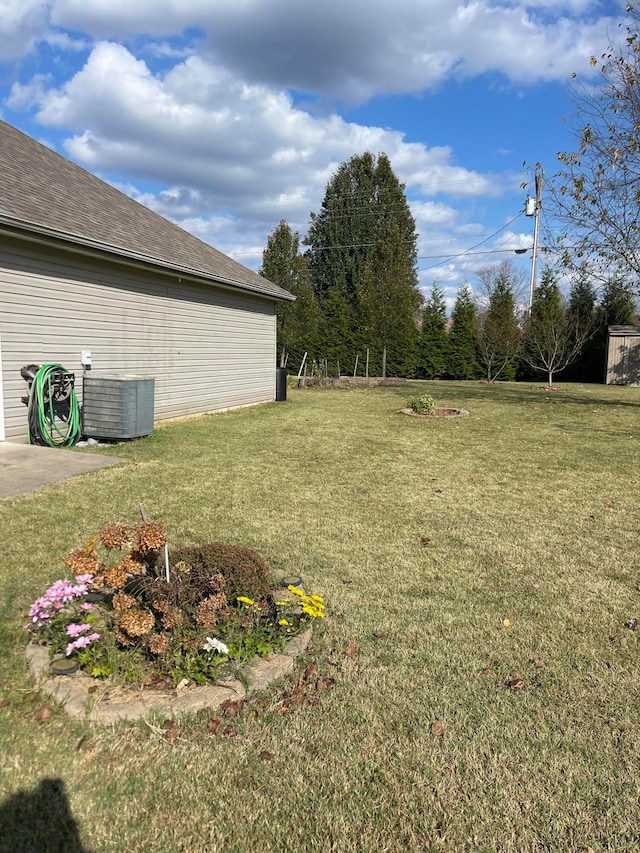 view of yard with central AC unit