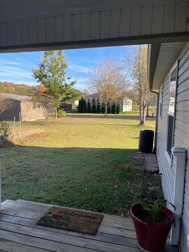 view of yard with a wooden deck