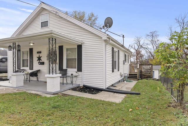 view of side of home featuring a lawn