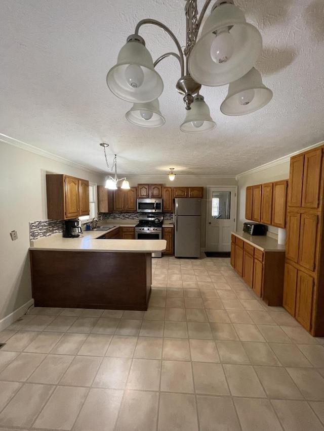 kitchen with sink, ornamental molding, kitchen peninsula, stainless steel appliances, and backsplash