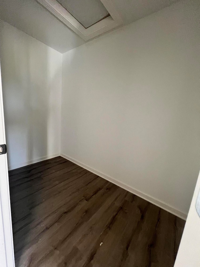 empty room with dark hardwood / wood-style floors