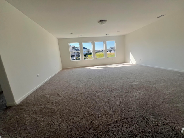 empty room featuring carpet flooring